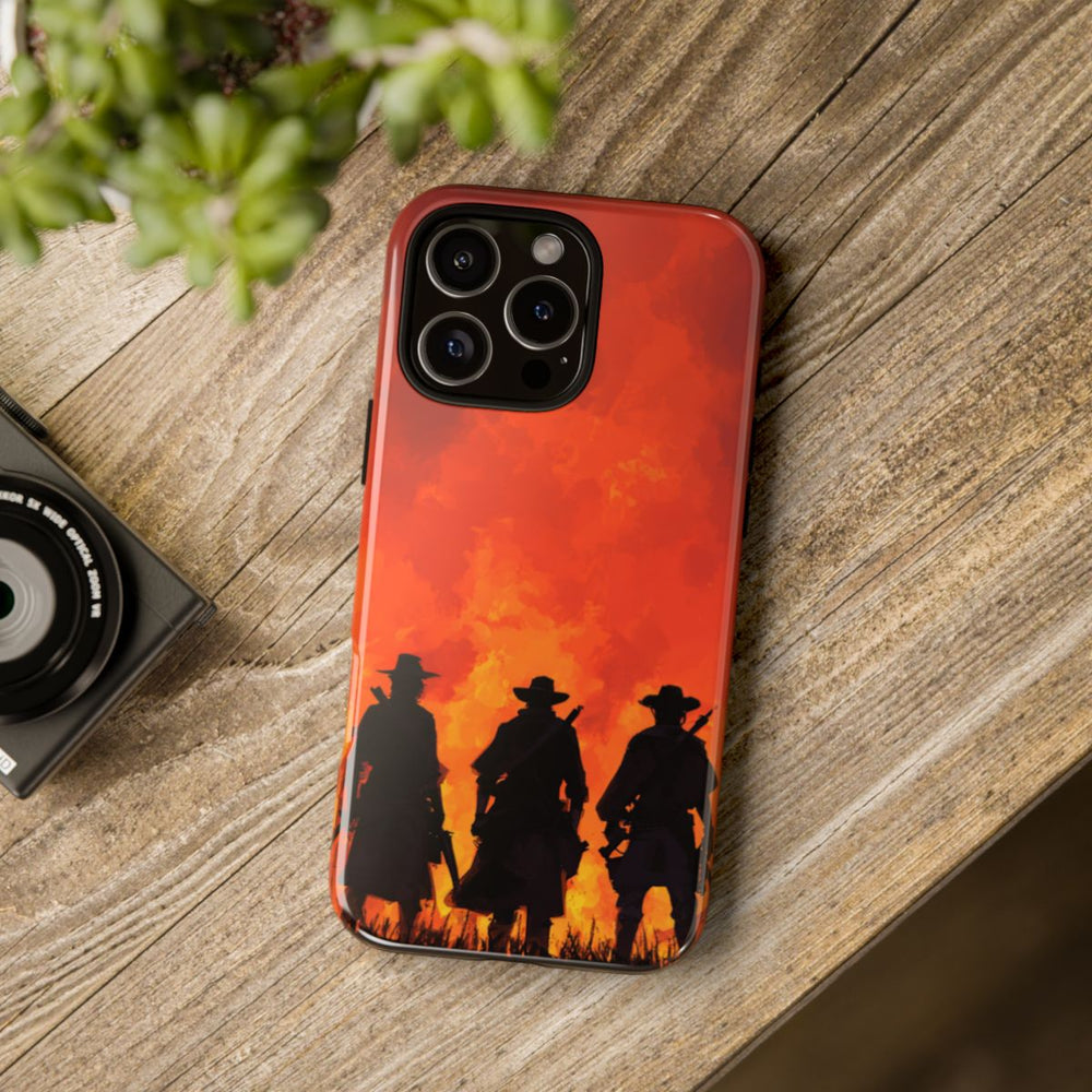 Silhouetten van Drie Cowboys Tegen Vurige Zonsondergang