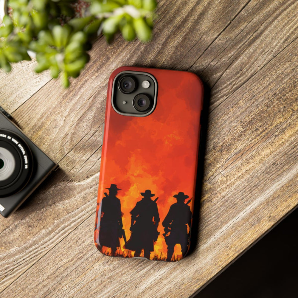 Silhouetten van Drie Cowboys bij Vurige Zonsondergang