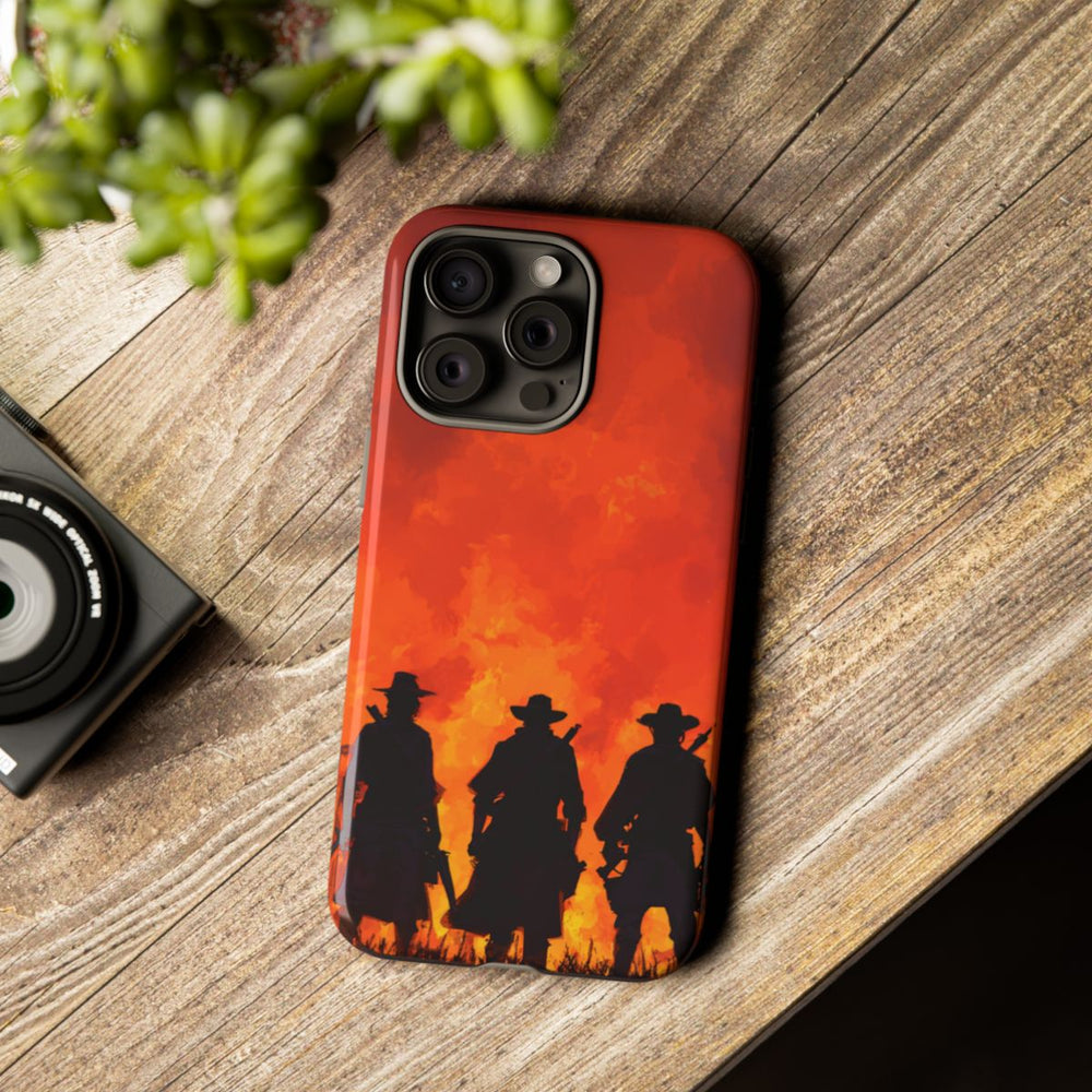 Silhouetten van Drie Cowboys Tegen Vurige Zonsondergang