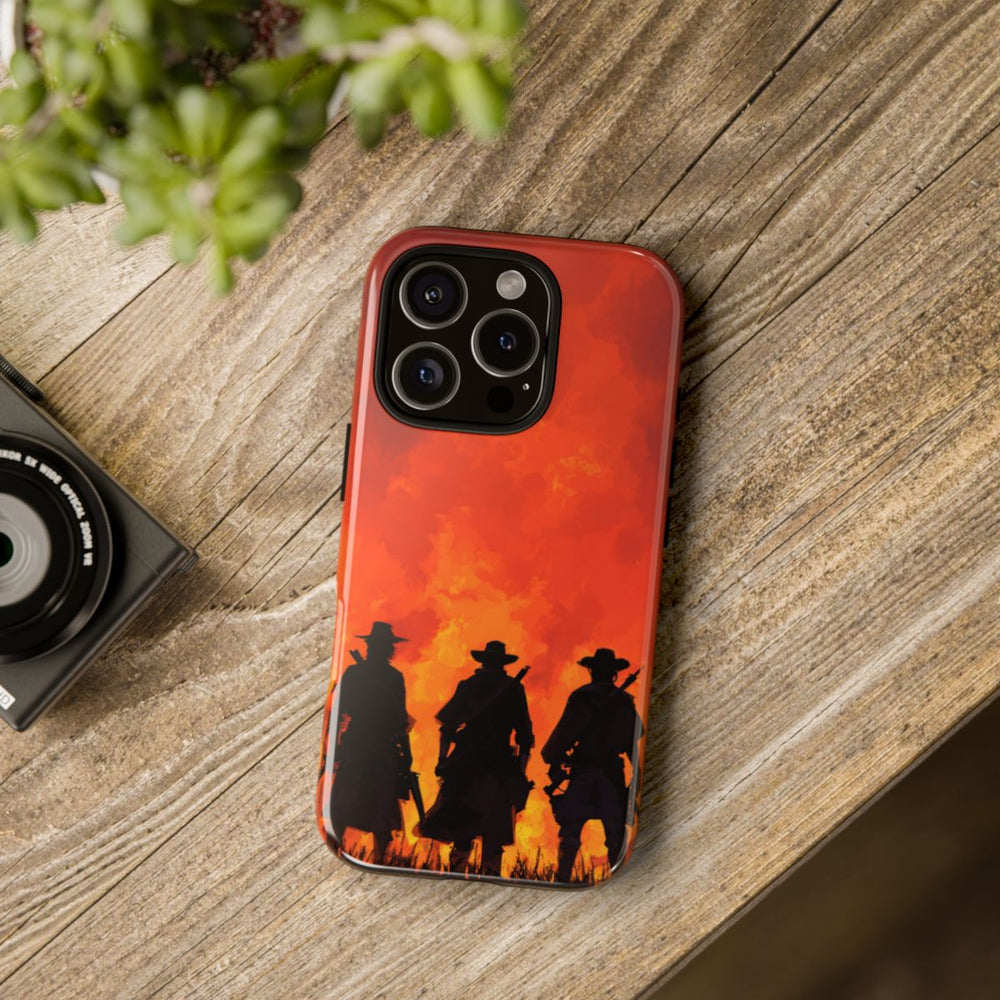 Silhouetten van Drie Cowboys bij Vurige Zonsondergang