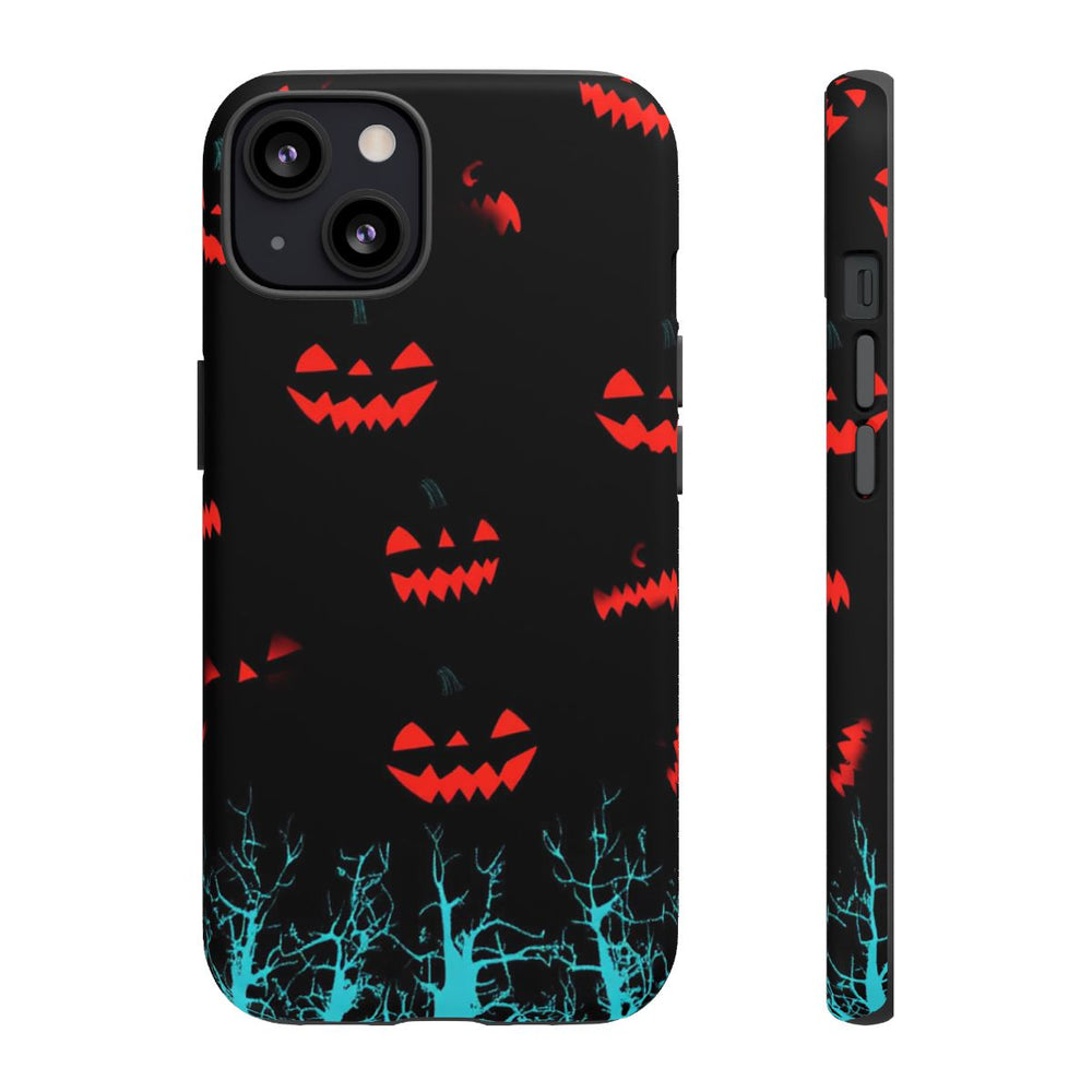 Gloeiende Pompoengezichten Boven Blauwe Bomen