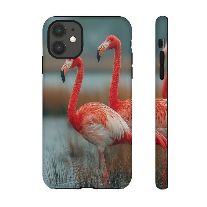 Drie Flamingo’s in Water met Gras