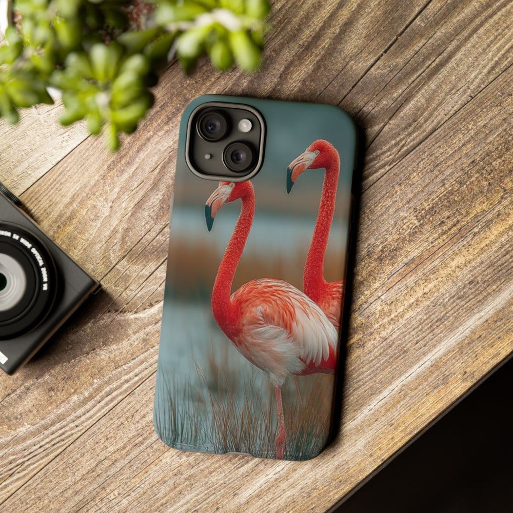 Drie Flamingo's bij Water en Riet