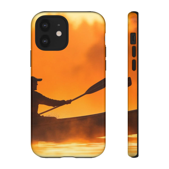 Silhouet van Kanoër bij Zonsondergang